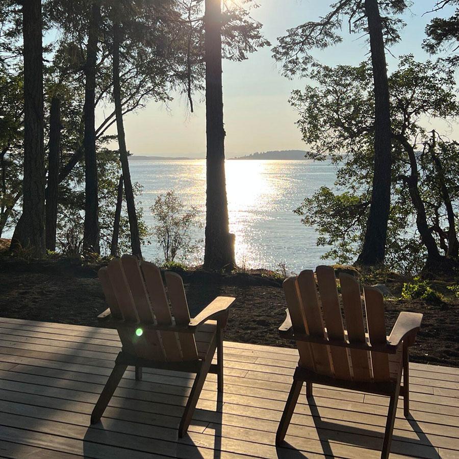 Photo of Two Chairs in front of a Waterfront Home on San Juan Islands